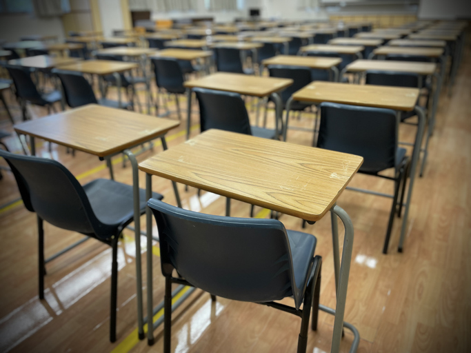 Empty Chairs And Table In Classroom